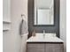 Well-lit powder room features a modern sink, vanity, and decorative mirror at 525 Springer Nw Bnd, Marietta, GA 30060