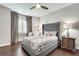 Bedroom with a stylish bed, gray headboard, dark hardwood floors and designer accents at 525 Springer Nw Bnd, Marietta, GA 30060