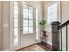 Bright entryway featuring frosted glass doors, wood floors, and elegant staircase at 525 Springer Nw Bnd, Marietta, GA 30060