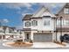 Charming two-story home featuring a gray two-car garage and inviting entrance at 525 Springer Nw Bnd, Marietta, GA 30060