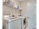 Laundry room with modern appliances and wire rack shelving at 525 Springer Nw Bnd, Marietta, GA 30060