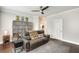 Cozy living room features a modern ceiling fan, comfortable seating, and stylish geometric rug at 525 Springer Nw Bnd, Marietta, GA 30060