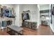 Spacious walk-in closet with custom shelving, drawers, hanging racks and hardwood floors at 525 Springer Nw Bnd, Marietta, GA 30060