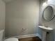 Powder room featuring pedestal sink and wood-look flooring at 6420 Olmadison Pl, Atlanta, GA 30349