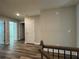 Upstairs hallway featuring wood-look flooring and multiple doors at 6420 Olmadison Pl, Atlanta, GA 30349