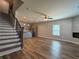 Spacious living area with a sleek fireplace, hardwood floors, and lots of natural light at 6420 Olmadison Pl, Atlanta, GA 30349