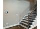 Staircase with hardwood stairs and iron spindles at 6420 Olmadison Pl, Atlanta, GA 30349