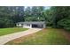 Elevated view of ranch style home with an attached carport and mature trees at 663 Embry Ln, Marietta, GA 30066