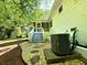 Picture of the back porch with stone landscaping, American flag and an exterior AC unit at 663 Embry Ln, Marietta, GA 30066