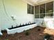 Brick home featuring a lovely backyard with fresh plantings and screened patio access at 663 Embry Ln, Marietta, GA 30066