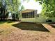 View of screened-in porch with a staircase leading to the grassy backyard at 663 Embry Ln, Marietta, GA 30066