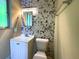 Small bathroom features a modern vanity, mosaic tile accents, and a window at 663 Embry Ln, Marietta, GA 30066