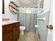 Cozy bathroom featuring a modern vanity and a shower with a gray shower curtain at 663 Embry Ln, Marietta, GA 30066