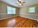 Inviting bedroom features hardwood floors, and a window with a lovely view at 663 Embry Ln, Marietta, GA 30066
