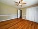 Spacious bedroom features hardwood floors, ceiling fan and lots of natural light at 663 Embry Ln, Marietta, GA 30066
