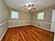 Cozy bedroom features hardwood floors, and two large windows with nice views at 663 Embry Ln, Marietta, GA 30066