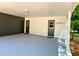 Large carport space with ample lighting and two access doors for convenience at 663 Embry Ln, Marietta, GA 30066