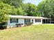 Inviting single-story home with updated white brick exterior and landscaped front yard at 663 Embry Ln, Marietta, GA 30066