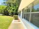Side view of home with brick exterior, well-maintained landscaping, and ample windows at 663 Embry Ln, Marietta, GA 30066