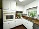Well-lit kitchen with plenty of counter space and white cabinets at 663 Embry Ln, Marietta, GA 30066