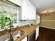Kitchen showcases stainless steel appliances, granite countertops and a view to the dining area at 663 Embry Ln, Marietta, GA 30066