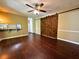 Open living room with wood floors, kitchen bar, and barn doors to another room at 663 Embry Ln, Marietta, GA 30066