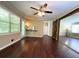 Open living room with wood floors, kitchen bar, and barn doors to another room at 663 Embry Ln, Marietta, GA 30066