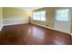 Spacious living room featuring hardwood floors and freshly painted walls at 663 Embry Ln, Marietta, GA 30066