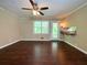 Open living room featuring hardwood floors, natural light, and built in display niche at 663 Embry Ln, Marietta, GA 30066