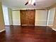 Stylish living area featuring barn door accent, built-in storage, and hardwood floors at 663 Embry Ln, Marietta, GA 30066