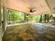 Bright sunroom with slate tile flooring and walls of windows with backyard view at 663 Embry Ln, Marietta, GA 30066