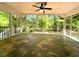 Bright sunroom with slate tile flooring and walls of windows overlooking the backyard at 663 Embry Ln, Marietta, GA 30066