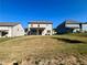 Expansive backyard featuring a well-maintained lawn and views of the surrounding neighborhood at 7665 Easton Valley Ln, Cumming, GA 30028