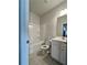 Bathroom features a tub and single sink at 7665 Easton Valley Ln, Cumming, GA 30028
