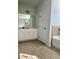 Bathroom featuring double sinks and a separate tub and shower at 7665 Easton Valley Ln, Cumming, GA 30028