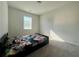 A tidy bedroom with a twin bed near a window at 7665 Easton Valley Ln, Cumming, GA 30028