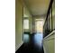 Bright entryway with hardwood floors, leading to other rooms at 7665 Easton Valley Ln, Cumming, GA 30028