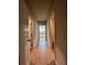 Hallway with tile flooring connecting bedrooms and bathrooms at 7665 Easton Valley Ln, Cumming, GA 30028