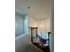 Stairway with carpeted treads and pendant lighting at 7665 Easton Valley Ln, Cumming, GA 30028