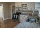 Modern kitchen with white cabinets, granite countertops, and stainless-steel appliances at 8424 Taylor Rd, Riverdale, GA 30274