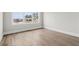 Bright, airy bedroom with hardwood floors, large window, and neutral paint colors at 3812 Havenrock Dr, Marietta, GA 30066