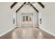 Vaulted bedroom with wooden beams, ceiling fan, and large windows at 3812 Havenrock Dr, Marietta, GA 30066
