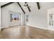 Vaulted bedroom with wooden beams, ceiling fan, hardwood flooring, and ensuite bathroom at 3812 Havenrock Dr, Marietta, GA 30066