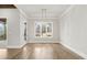 Bright dining room with hardwood floors, large windows, and modern chandelier at 3812 Havenrock Dr, Marietta, GA 30066