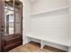 Entryway with a wooden front door, bench seating, shiplap wall, and wood floors at 3812 Havenrock Dr, Marietta, GA 30066