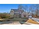 Stunning two-story brick home featuring an attached two car garage and manicured front lawn at 3812 Havenrock Dr, Marietta, GA 30066