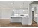 Bright kitchen features an island with white countertops and pendant lighting at 3812 Havenrock Dr, Marietta, GA 30066