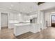 Bright kitchen features an island with white countertops, pendant lighting, and stainless steel appliances at 3812 Havenrock Dr, Marietta, GA 30066