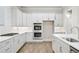Bright kitchen features white countertops and stainless steel appliances at 3812 Havenrock Dr, Marietta, GA 30066