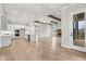 Open-concept living space with kitchen island, fireplace, and access to covered porch at 3812 Havenrock Dr, Marietta, GA 30066